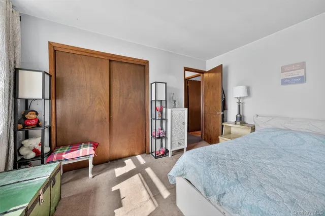 a bed room with a bed and a desk