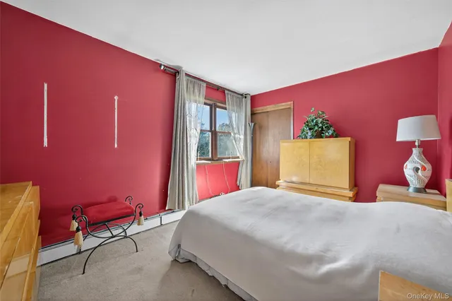 a bedroom with a bed and a chair