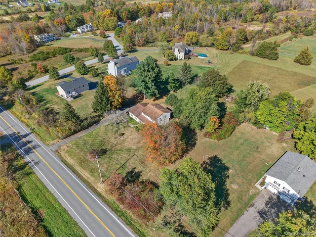 an aerial view of residential houses with outdoor space