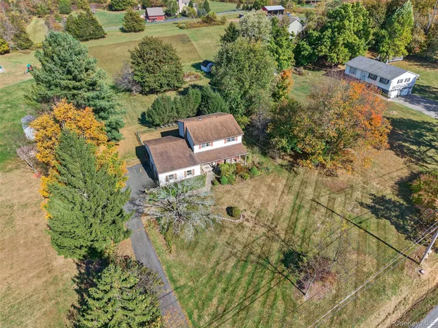 an aerial view of residential house with outdoor space
