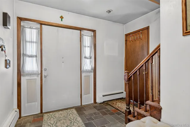 a view of a hallway with a dining area