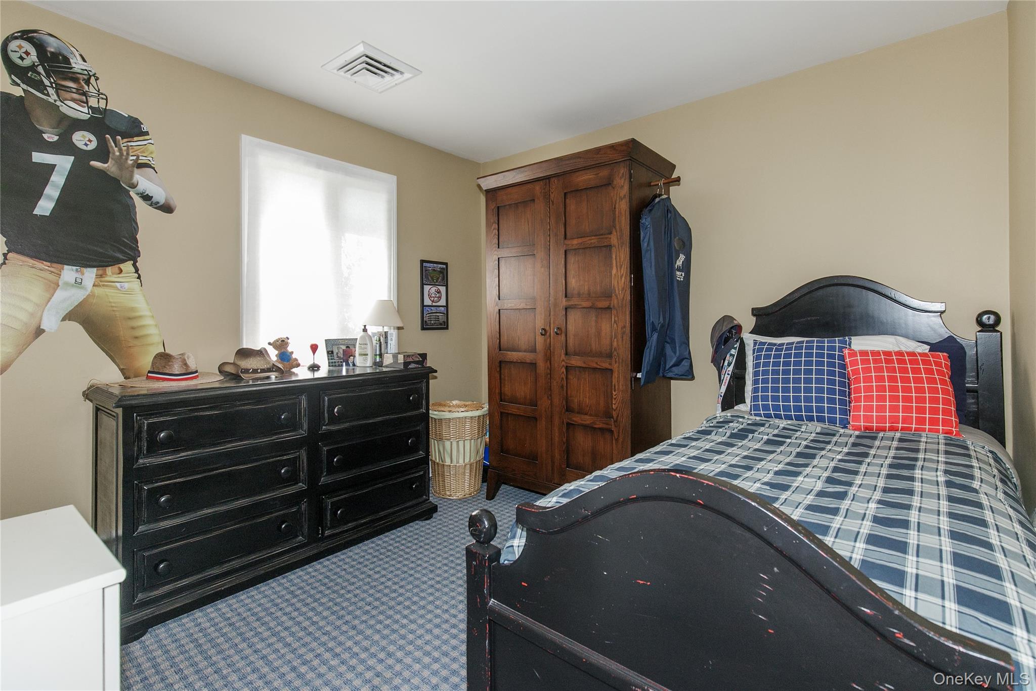 61 Mitchell Avenue Plainview, NY 11803 - Photo 11 of 24 a bedroom with a bed and a dresser