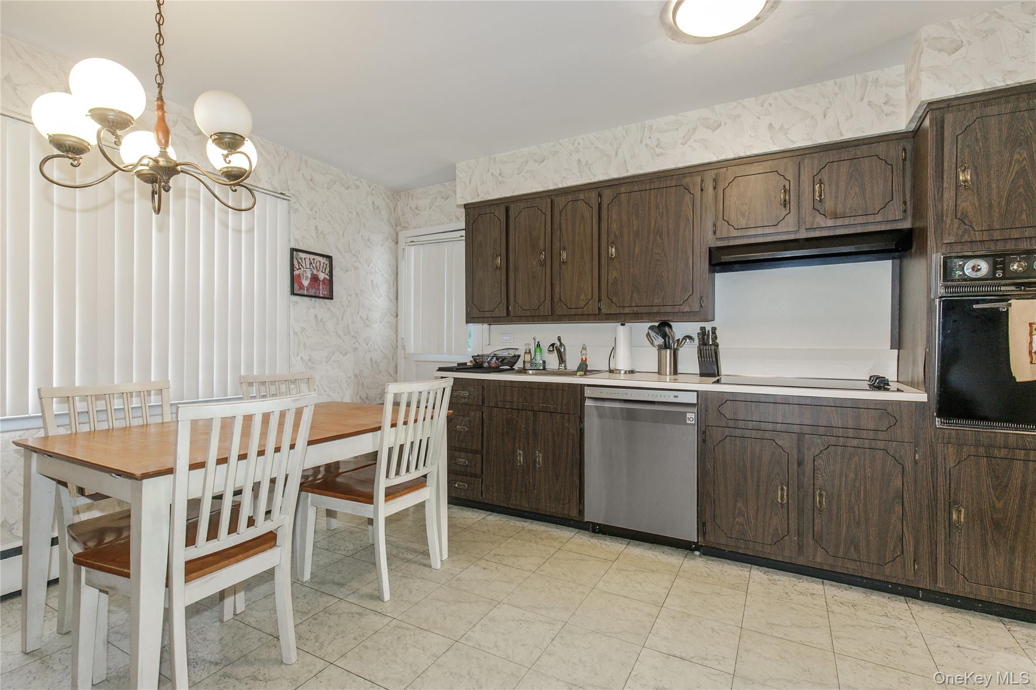 61 Mitchell Avenue Plainview, NY 11803 - Photo 2 of 24 a kitchen with a cabinets a sink and appliances