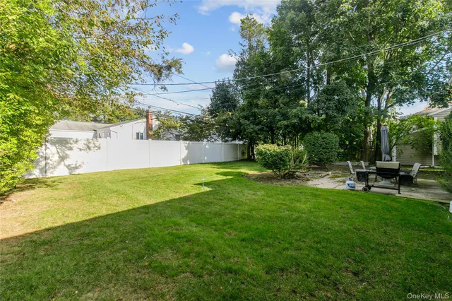 a view of a house with a yard porch and sitting area