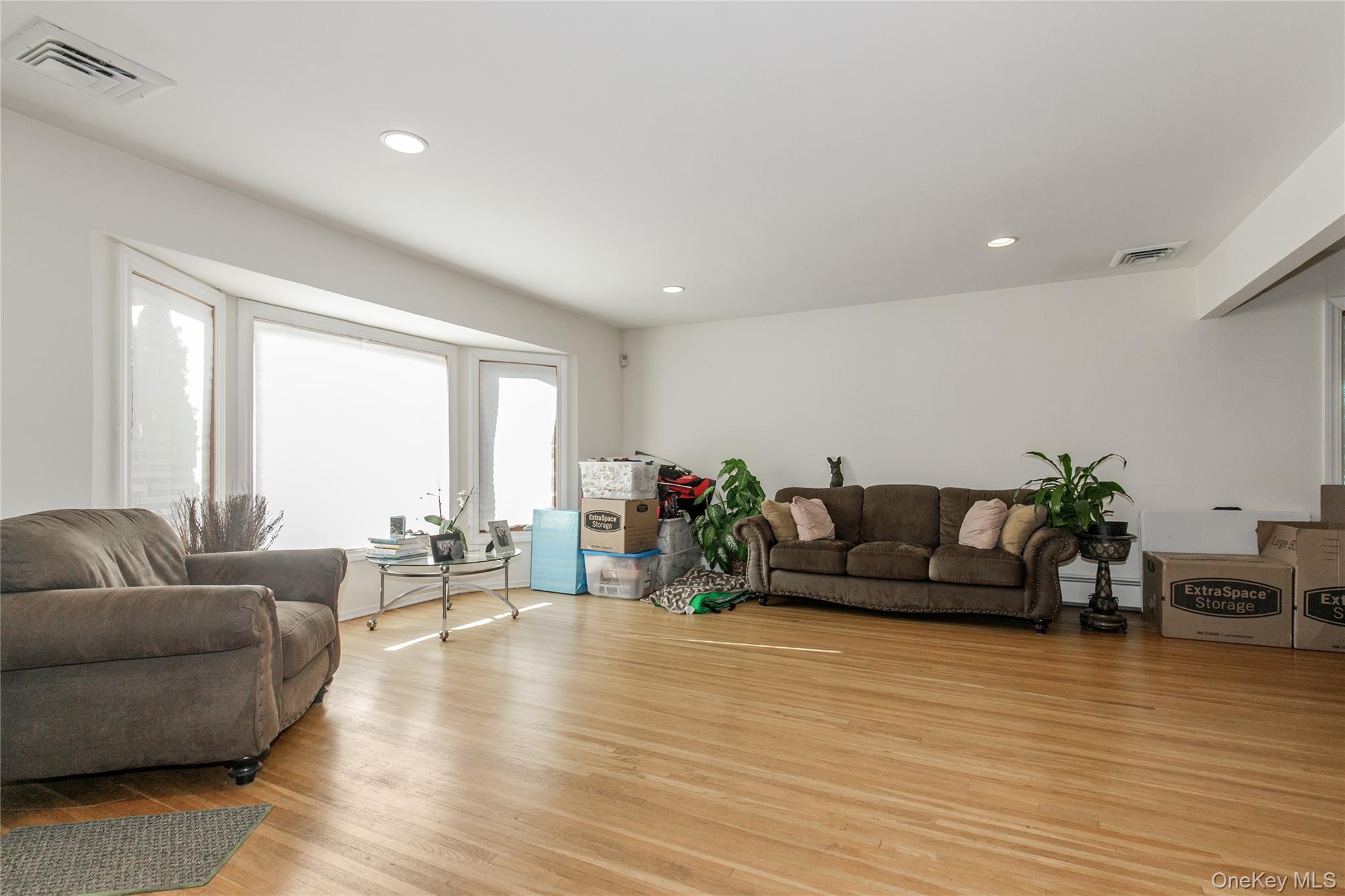 61 Mitchell Avenue Plainview, NY 11803 - Photo 4 of 24 a living room with furniture and wooden floor