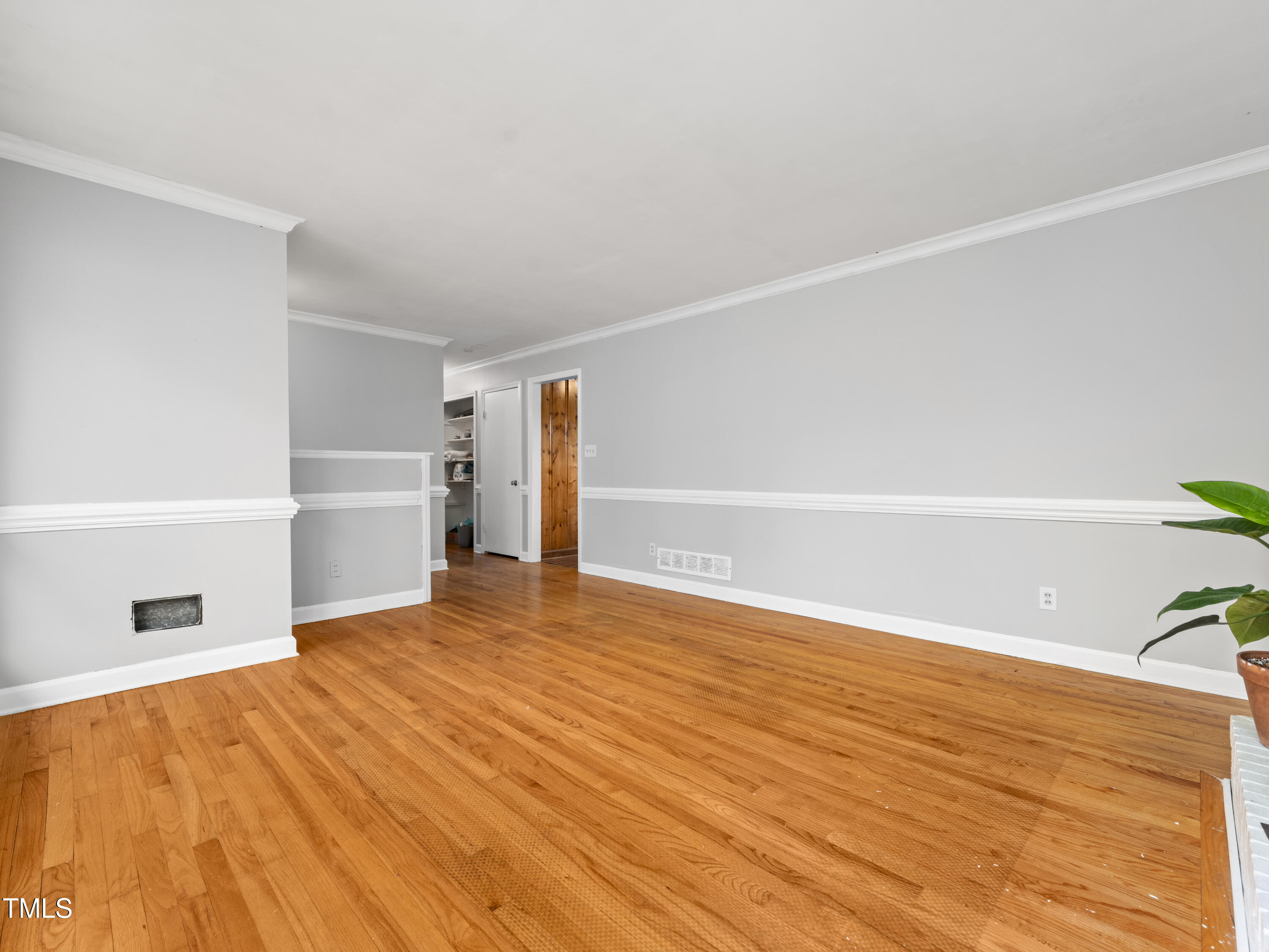 3428 Starmount Drive Raleigh, NC 27604 - Photo 5 of 31 Hardwood floors in living room, hall and 3 bedrooms