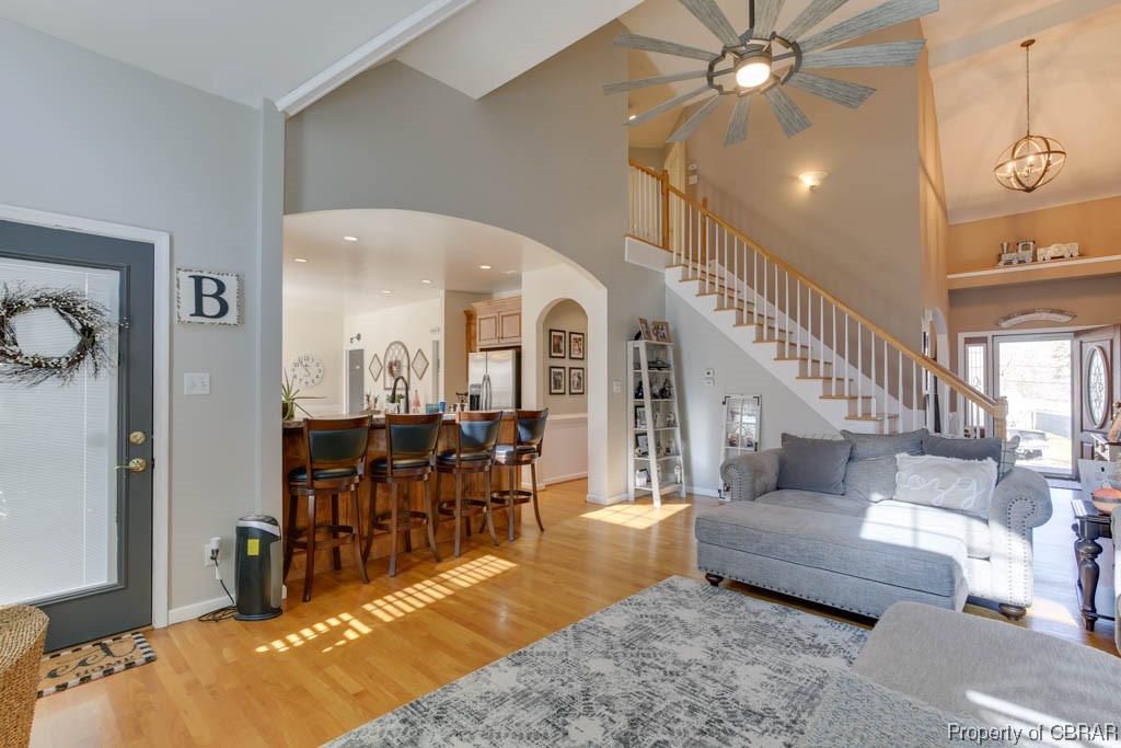 4 Willow Road Hampton, VA 23664 - Photo 14 of 48 Living room with light wood-type flooring, a high ceiling, and ceiling fan