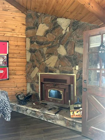 a kitchen with a stove a sink a microwave and cabinets