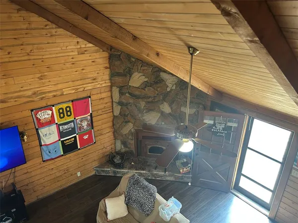 a outdoor space with lots of furniture and wooden floor