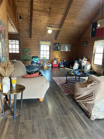 a kitchen with a stove a sink a microwave and cabinets