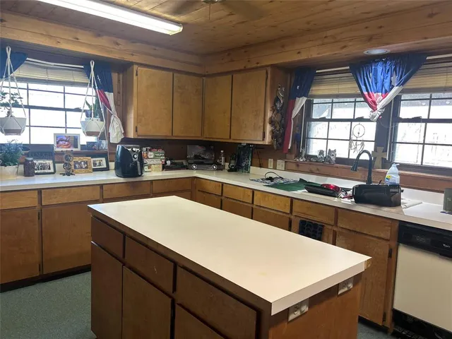a dining room with furniture and a window