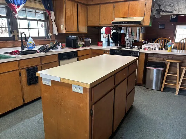 a bed room with a bed and a chair