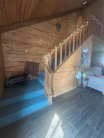 a bed room with a bed and a chair