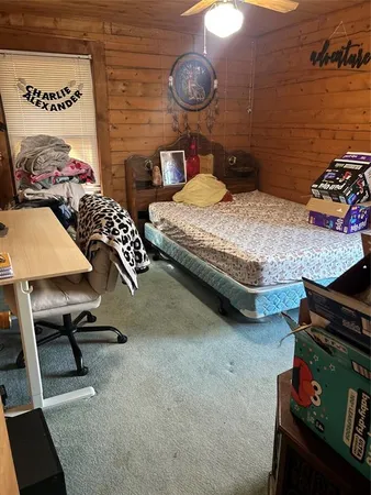 a bed room with bed and a window