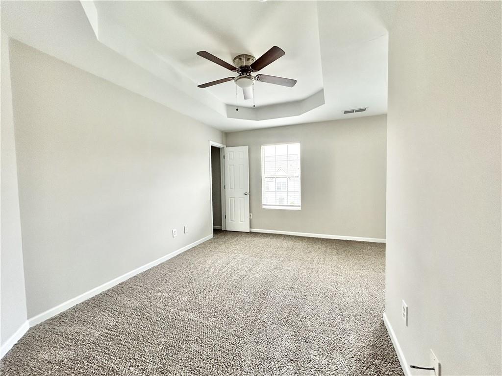 736 Wheel House Lane, Unit B Monroe, GA 30655 - Photo 12 of 15 a view of a livingroom with a ceiling fan and window