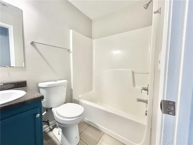 a bathroom with a toilet and a bathtub