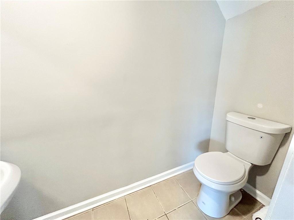 736 Wheel House Lane, Unit B Monroe, GA 30655 - Photo 15 of 15 a white toilet sitting next to a white wall
