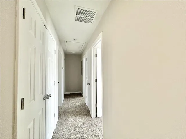 a view of a hallway with closet