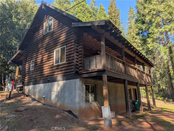 a view of a house with a tree