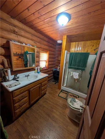 a blue bench sitting in a bathroom