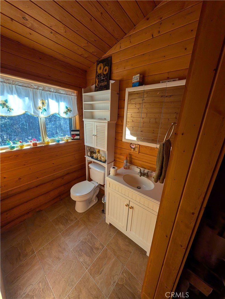 4715 Peregrine Road Forest Ranch, CA 95942 - Photo 9 of 13 a bathroom with a granite countertop sink toilet and shower
