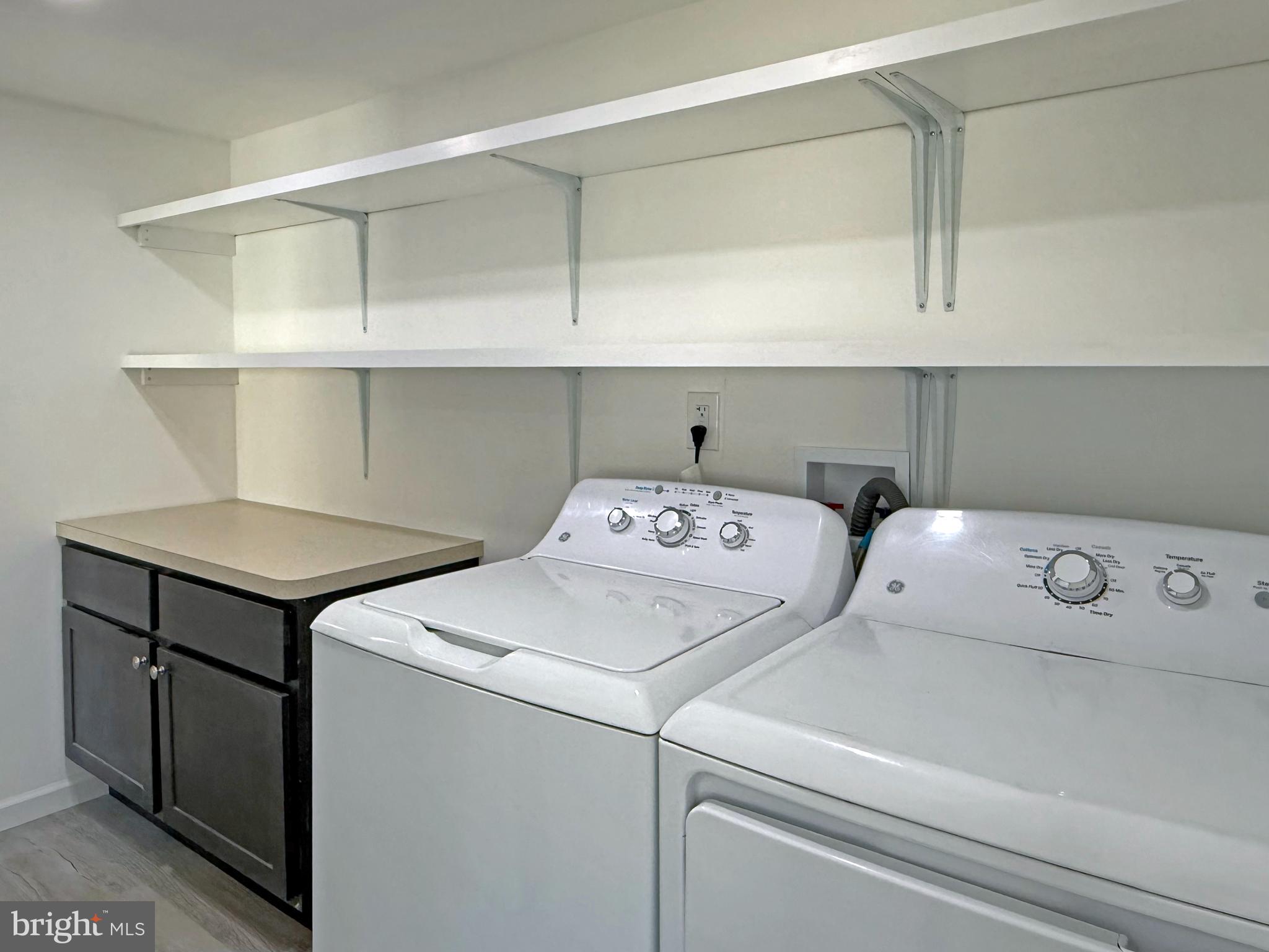 33308 Lighthouse Court, Unit D18 Lewes, DE 19958 - Photo 15 of 39 a utility room with dryer and washer