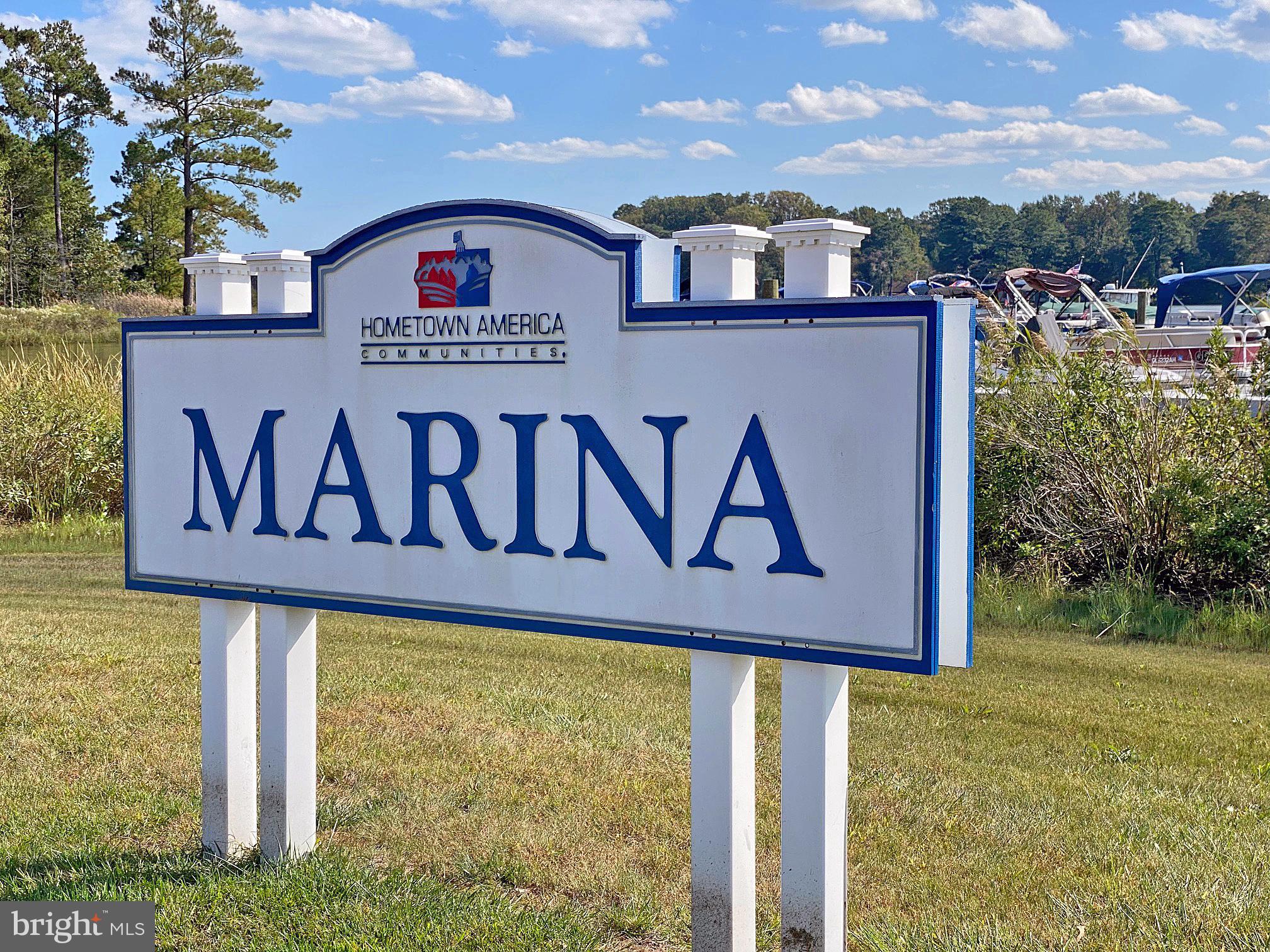 33308 Lighthouse Court, Unit D18 Lewes, DE 19958 - Photo 29 of 39 a street sign that is on a pole