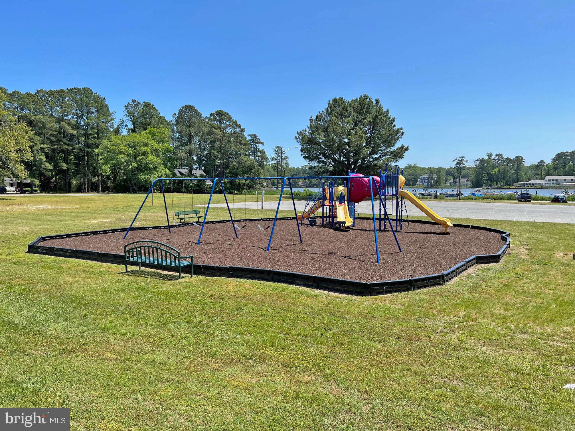 33308 Lighthouse Court, Unit D18 Lewes, DE 19958 - Photo 37 of 39 a view of a swimming pool with a yard