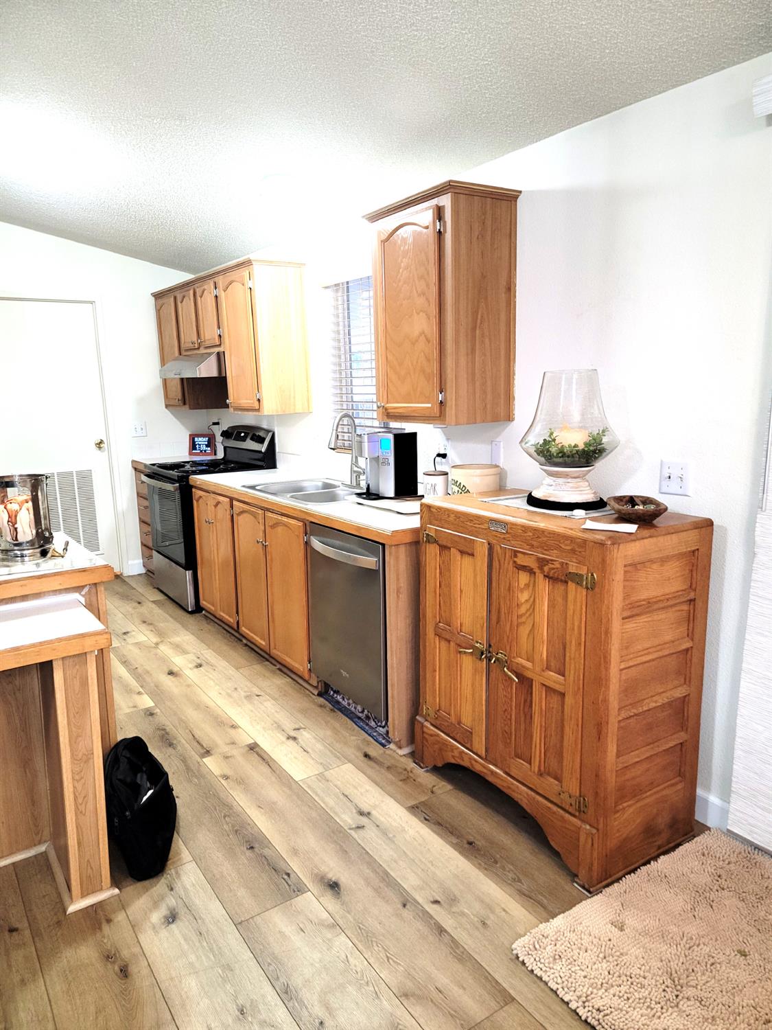 3550 China Garden Road, Unit 59 Placerville, CA 95667 - Photo 12 of 18 a kitchen with stainless steel appliances granite countertop a stove a sink and a refrigerator