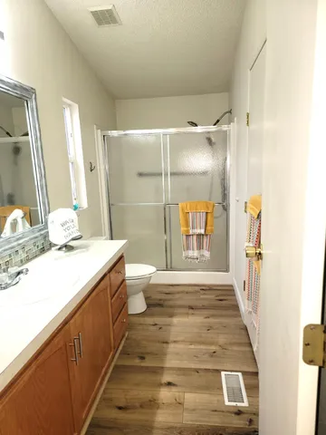 a bathroom with a shower and a bath tub