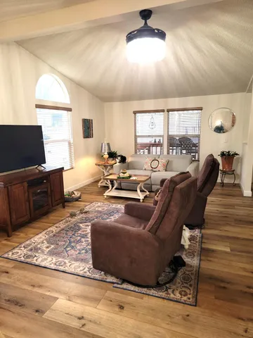 a living room with furniture and a rug