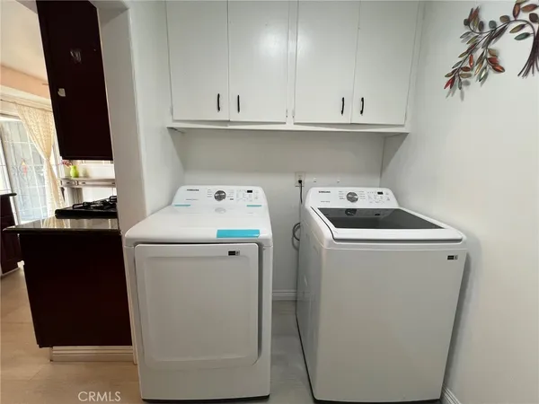 a utility room with dryer and washer