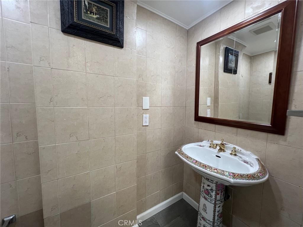 601 Camino Grove Avenue Arcadia, CA 91006 - Photo 9 of 15 a bathroom with a sink a mirror and toilet