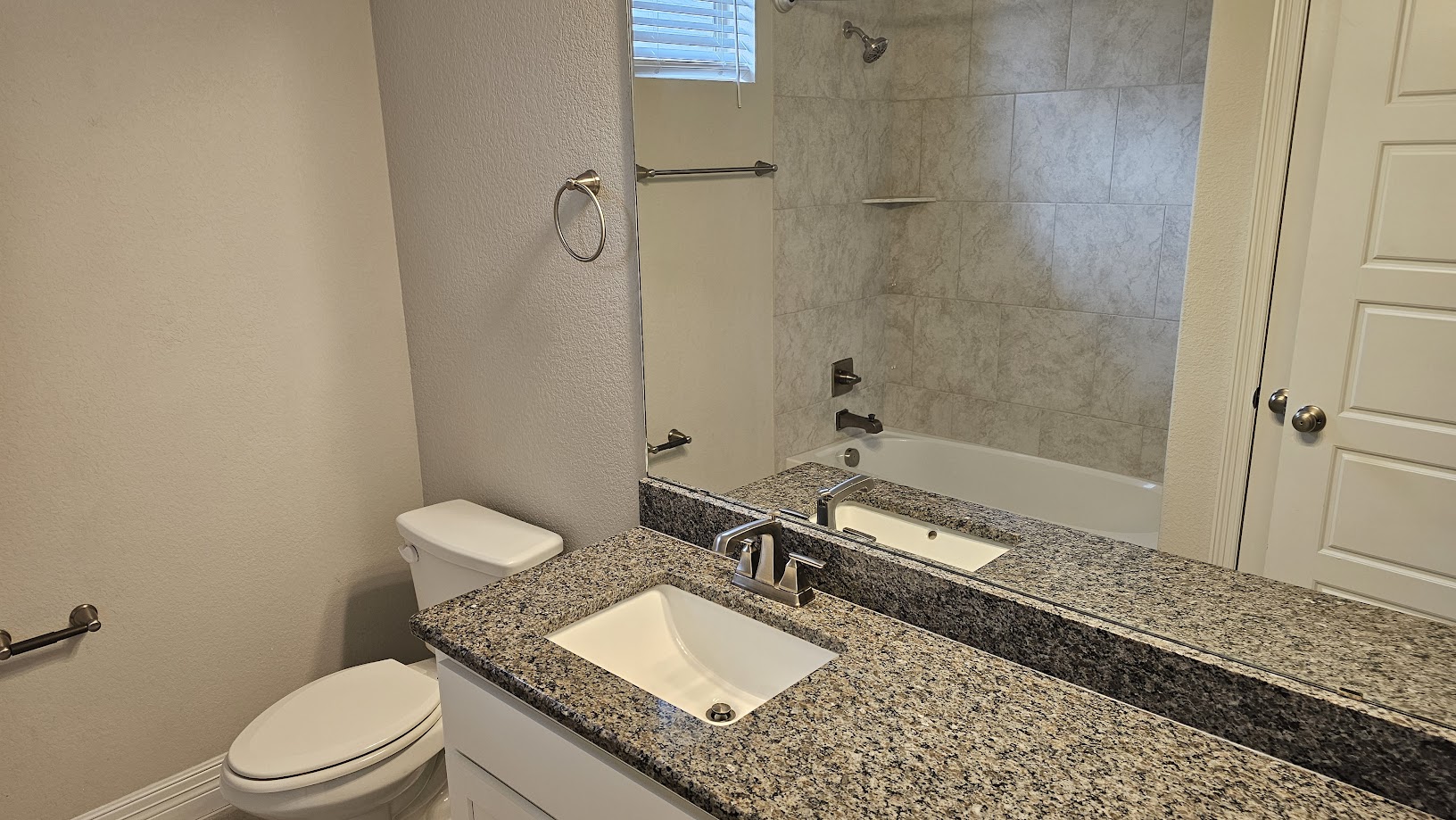 712 Muster Bend Georgetown, TX 78626 - Photo 14 of 26 Bathroom with toilet, a textured wall, bathtub / shower combination, and vanity