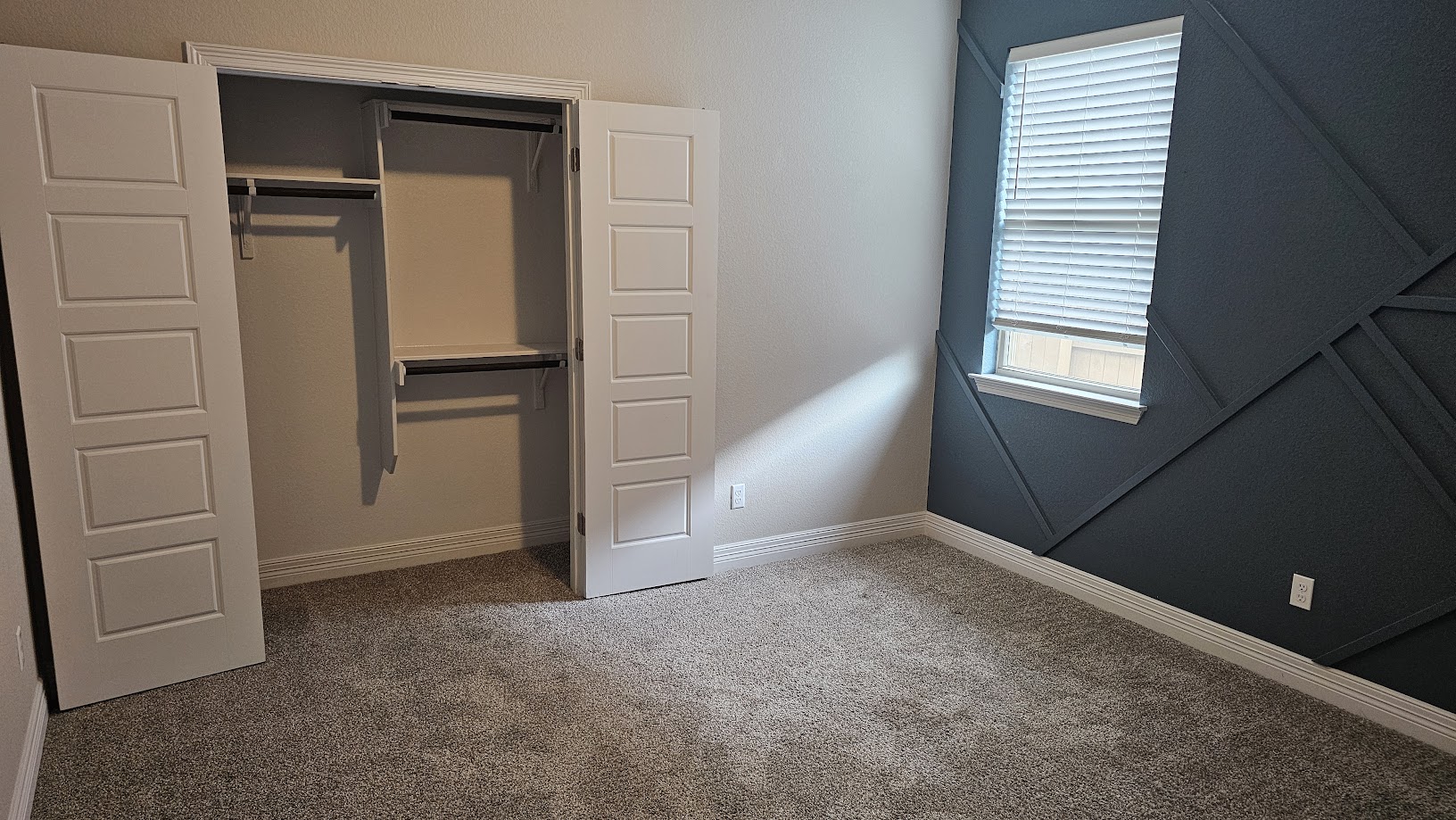 712 Muster Bend Georgetown, TX 78626 - Photo 15 of 26 Unfurnished bedroom with a closet, dark carpet, and baseboards