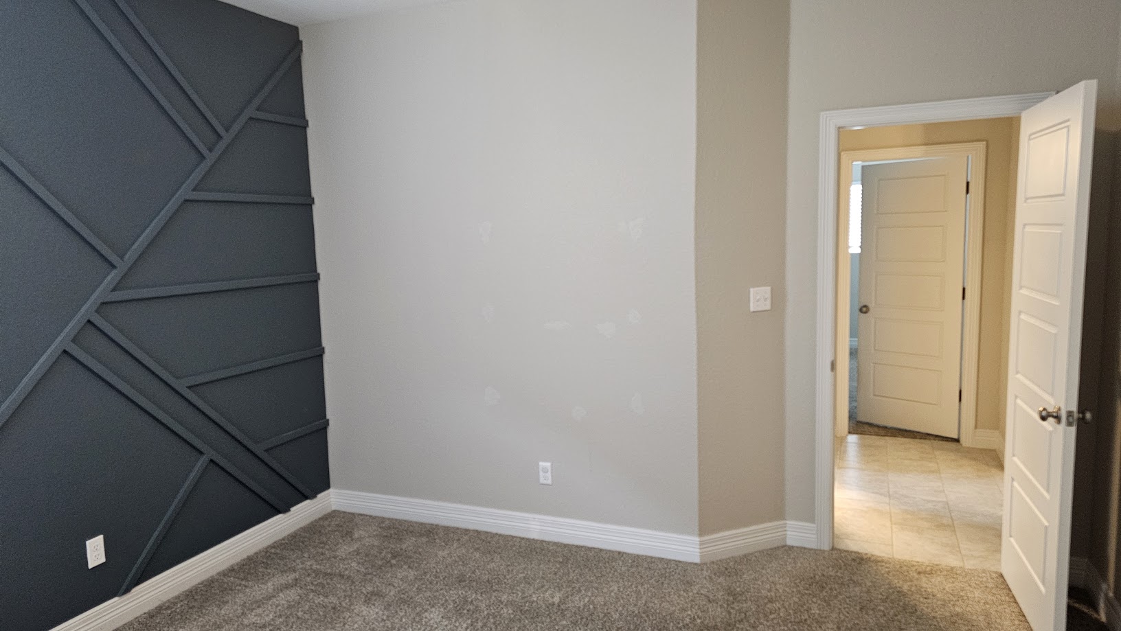 712 Muster Bend Georgetown, TX 78626 - Photo 16 of 26 Unfurnished room with light colored carpet, baseboards, and light tile patterned floors