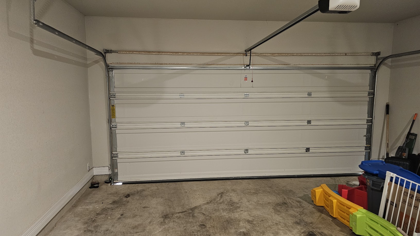 712 Muster Bend Georgetown, TX 78626 - Photo 17 of 26 Garage featuring baseboards and a garage door opener