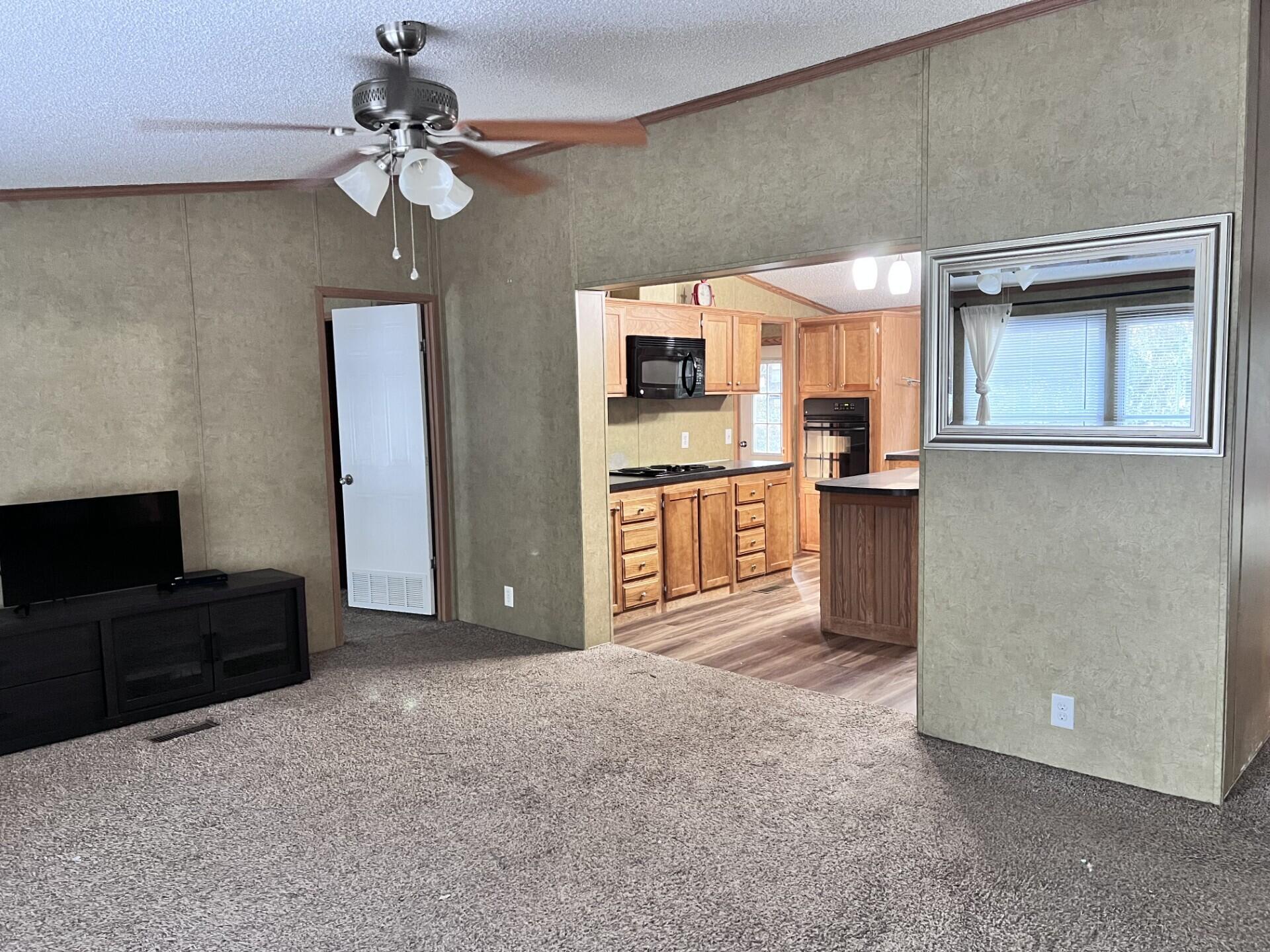 4309 Rebecca Road Crestview, FL 32539 - Photo 2 of 4 a view of a kitchen with a sink and a refrigerator