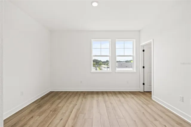 a white bath tub sitting next to a white toilet and a shower