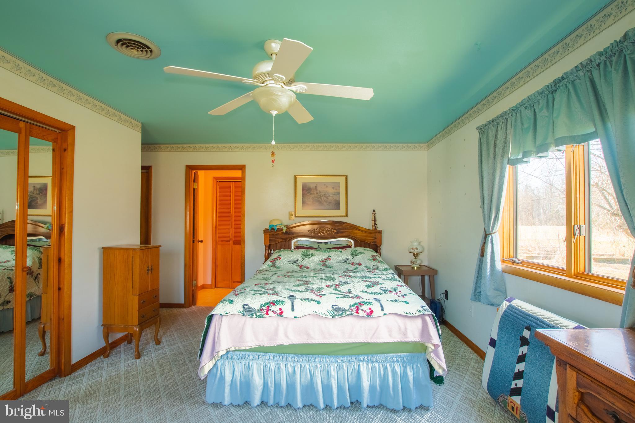 274 Robinson Road Salem, NJ 08079 - Photo 19 of 37 a bed sitting in a bedroom next to a window