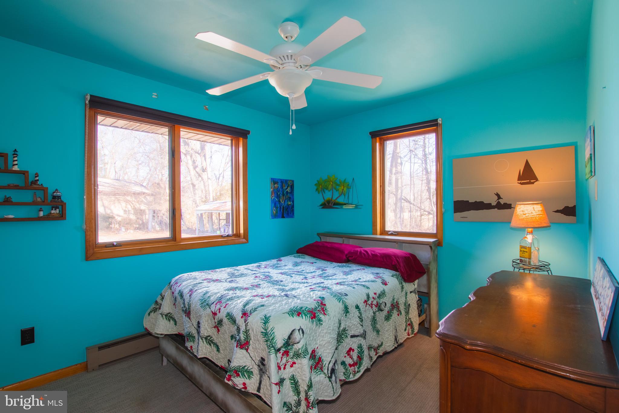 274 Robinson Road Salem, NJ 08079 - Photo 23 of 37 a bedroom with a bed and a chandelier