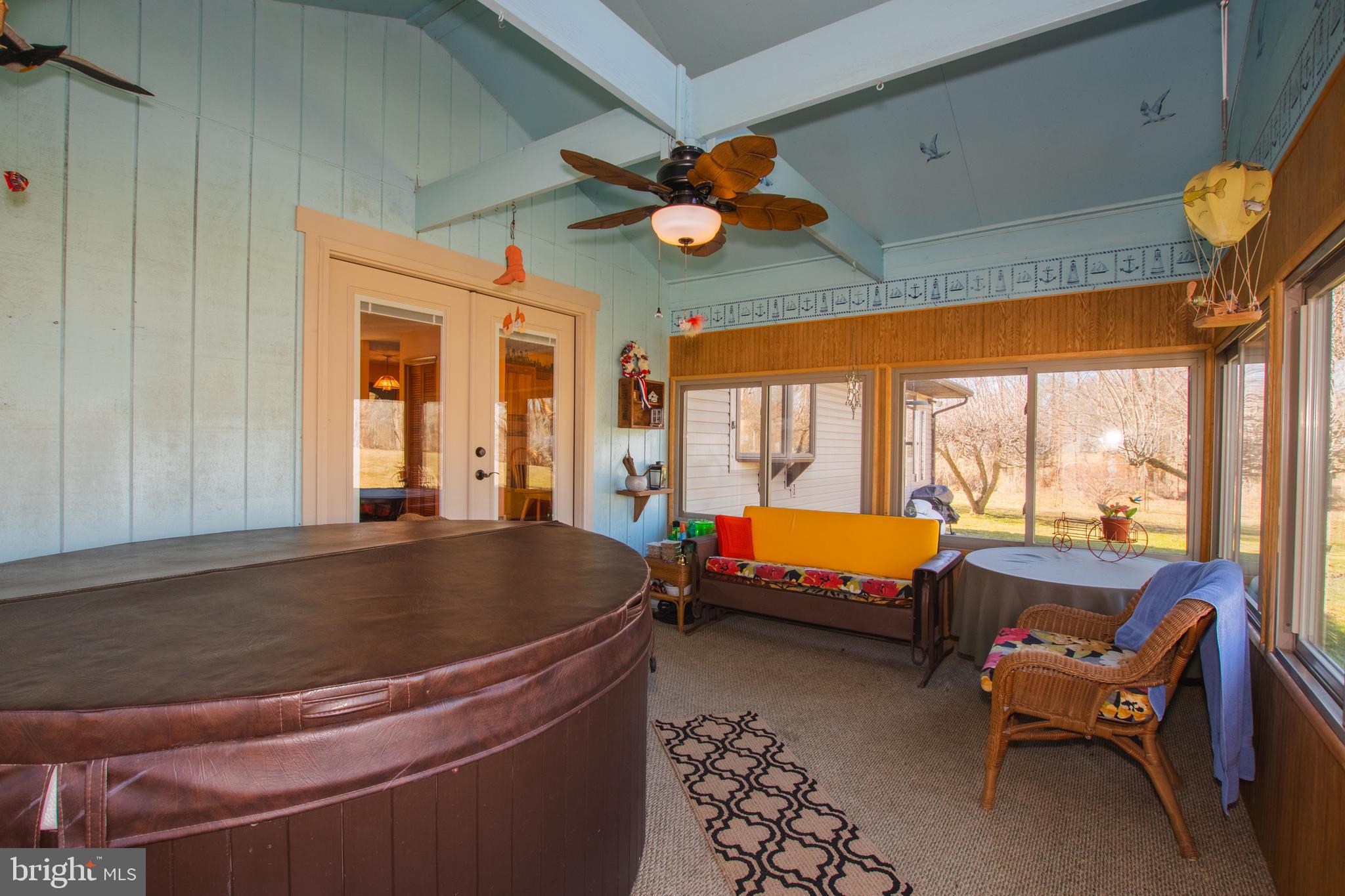 274 Robinson Road Salem, NJ 08079 - Photo 27 of 37 a living room with blue lights furniture and a large window
