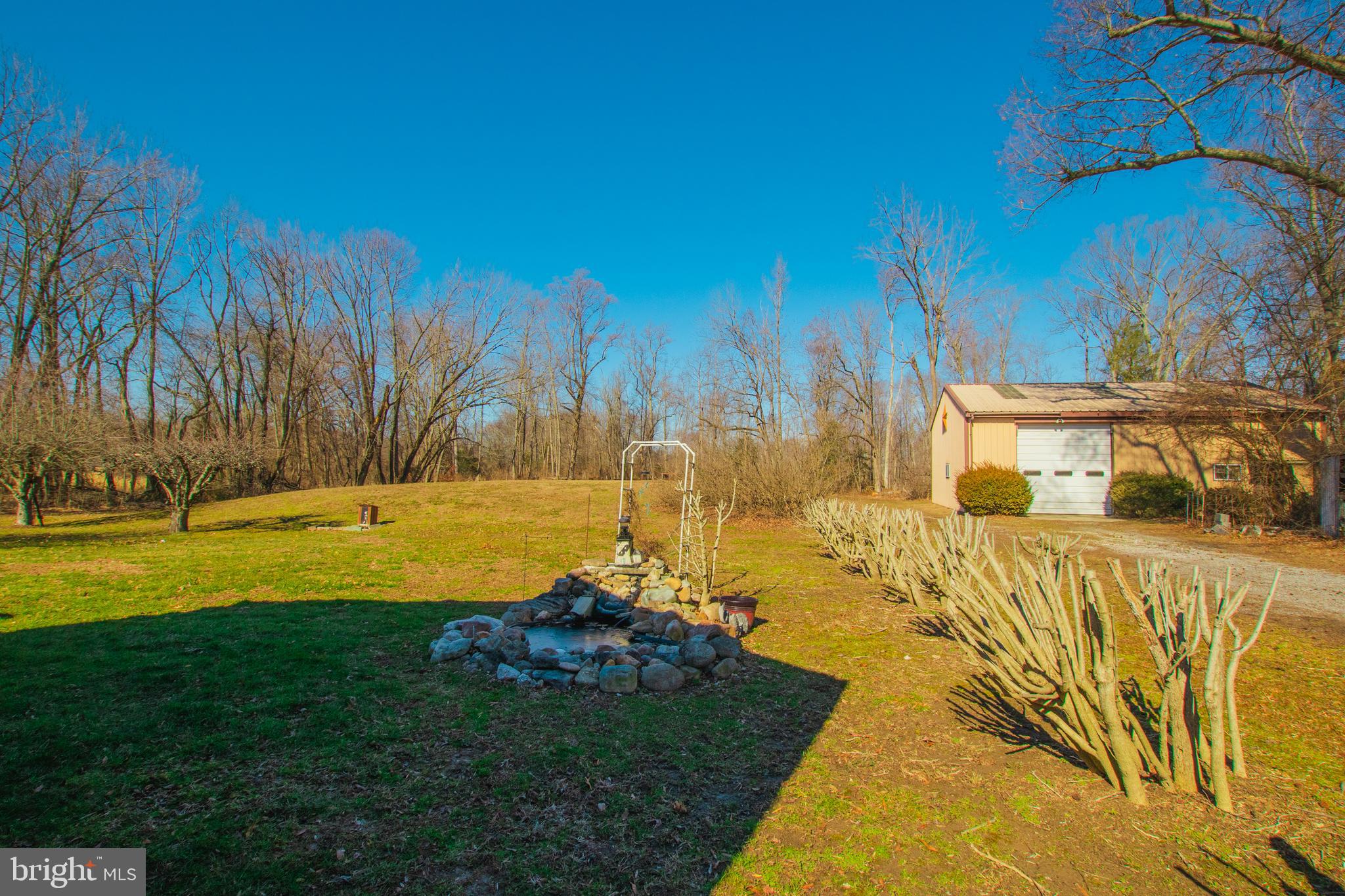 274 Robinson Road Salem, NJ 08079 - Photo 28 of 37 a view of swimming pool with lawn chairs and plants