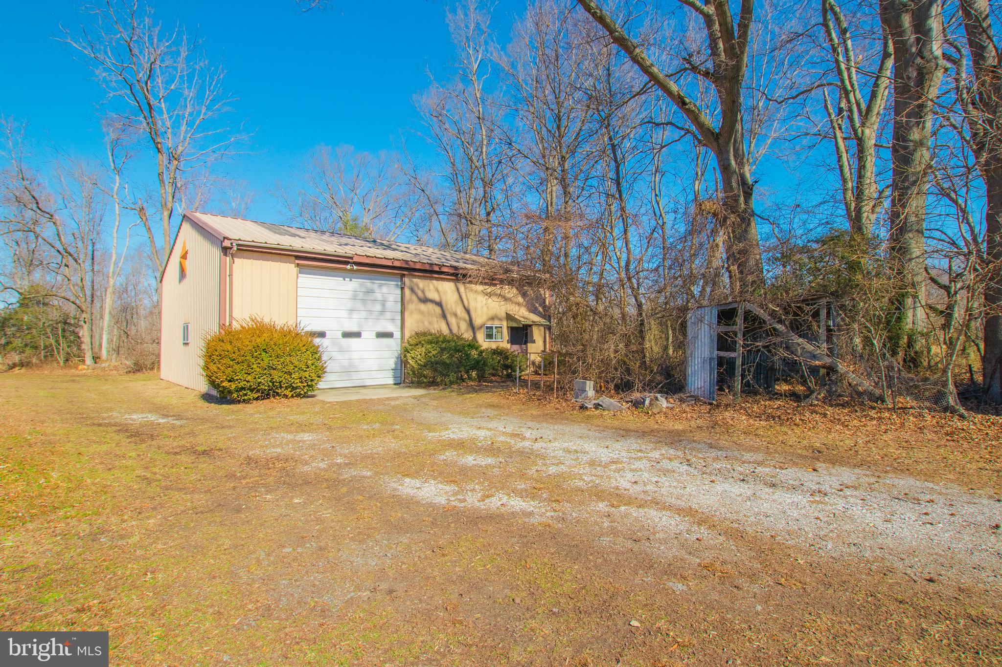 274 Robinson Road Salem, NJ 08079 - Photo 30 of 37 a front view of a house with a yard and garage