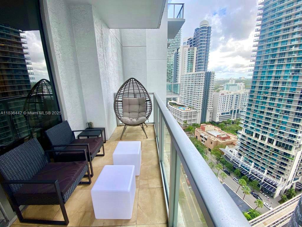 1050 Brickell Avenue, Unit 2220 Miami, FL 33131 - Photo 14 of 20 a view of balcony with furniture