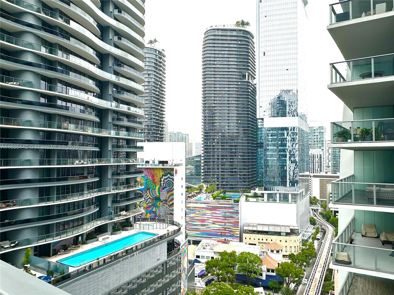 1050 Brickell Avenue, Unit 2220 Miami, FL 33131 - Photo 15 of 20 a backyard of a house with barbeque oven and outdoor seating