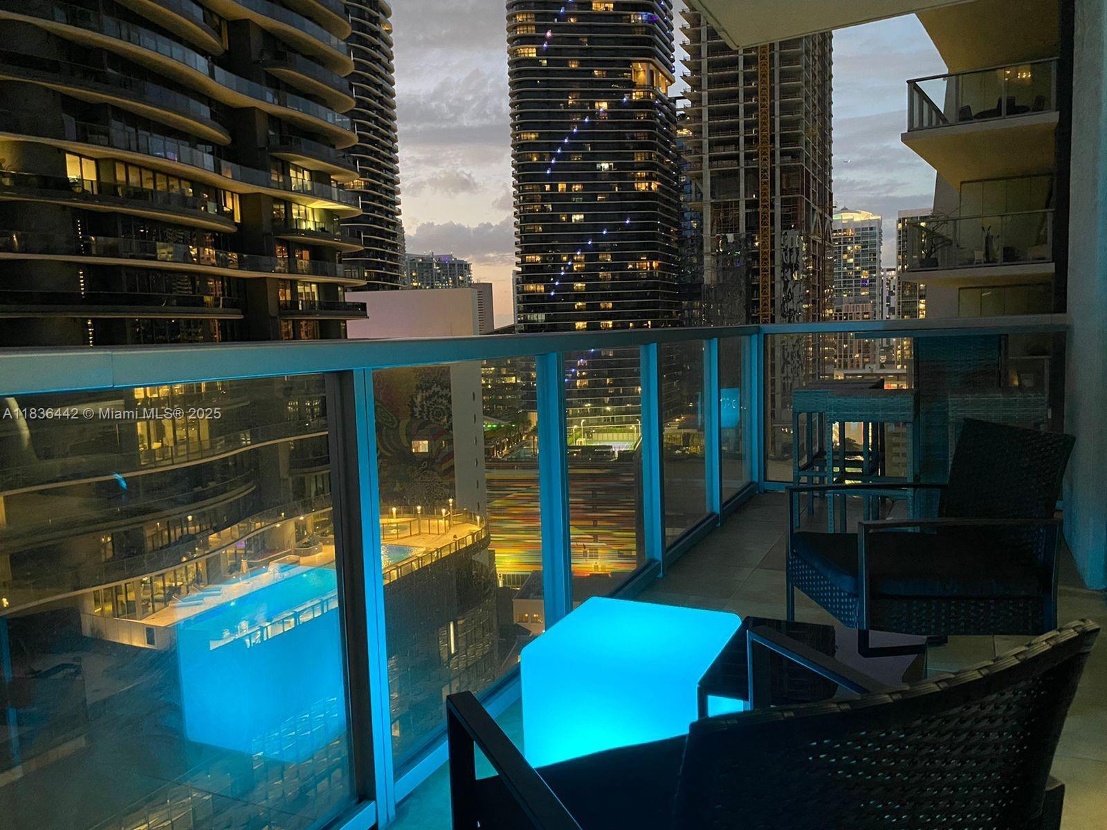 1050 Brickell Avenue, Unit 2220 Miami, FL 33131 - Photo 18 of 20 a view of a balcony with chairs