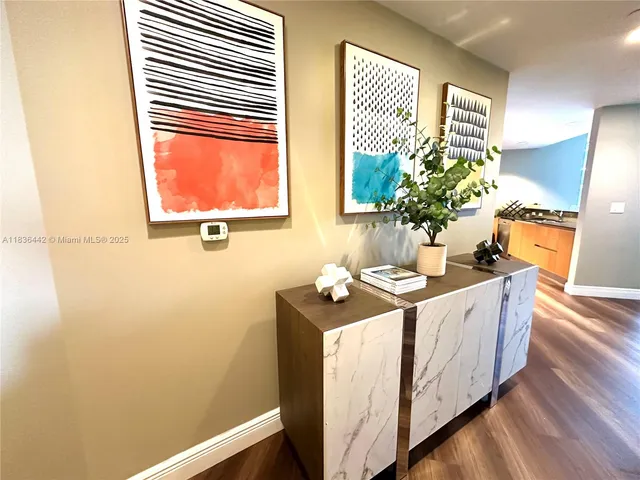 a spacious bathroom with a granite countertop sink and a window
