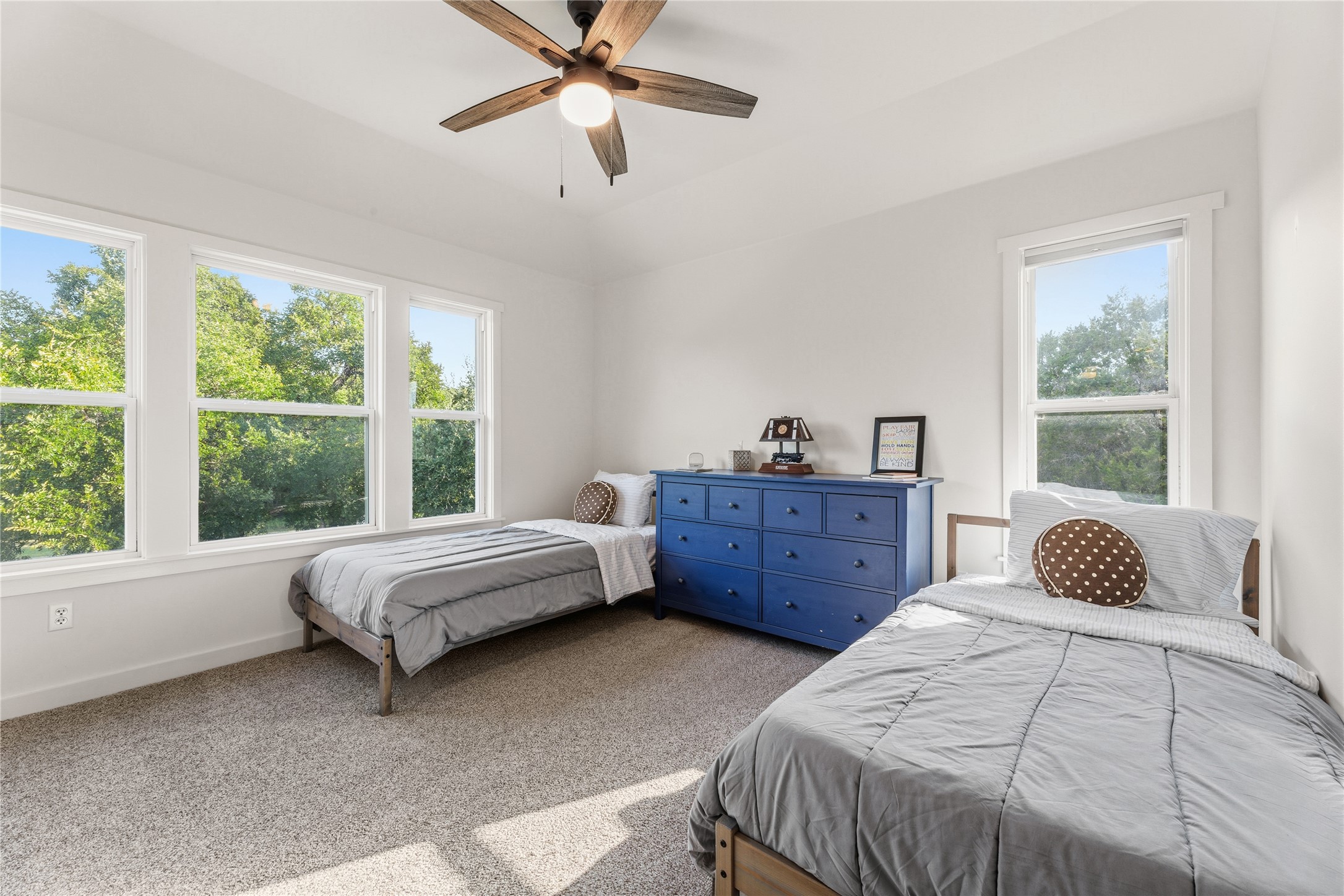 12901 Wire Road Leander, TX 78641 - Photo 16 of 40 Generous windows frame peaceful neighborhood views in this light-filled second bedroom with classic molding.