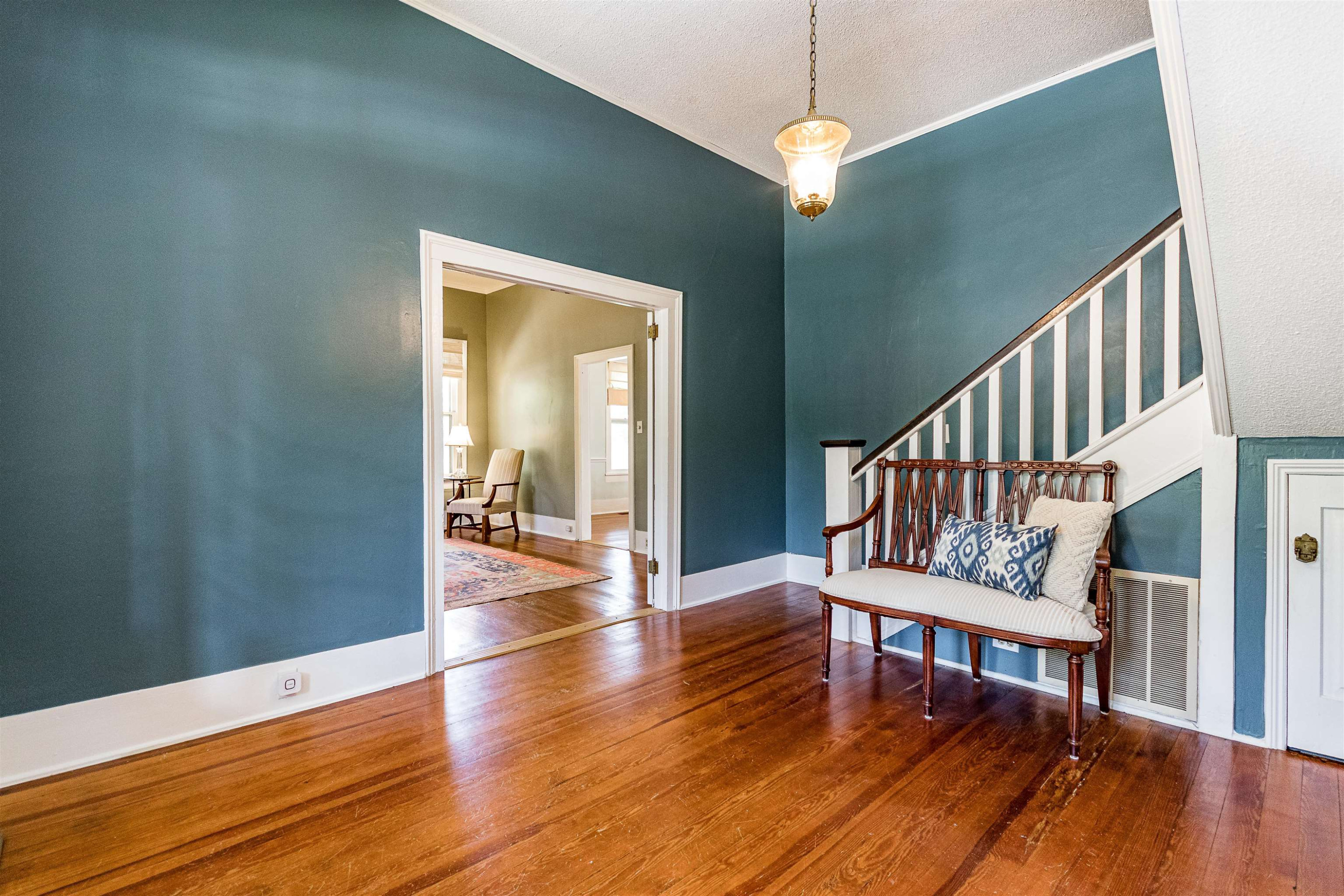 6467 Cleveland Road Clayton, NC 27520 - Photo 54 of 54 To the left moves you into a formal living room with fireplace and Heart of Pine flooring A Flowing Floorplan
